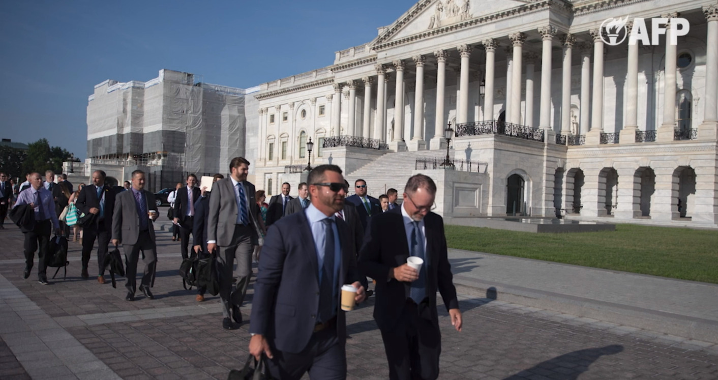 Group of people walking outside at the United States Capitol Complex