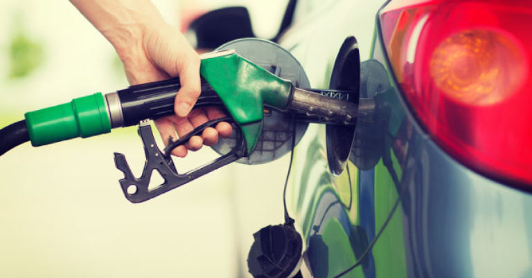 Man pumping gas into car