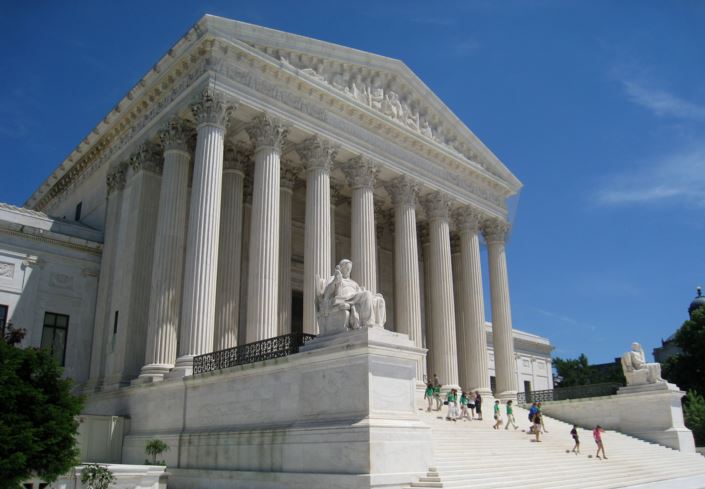 surpreme court with people walking up the steps