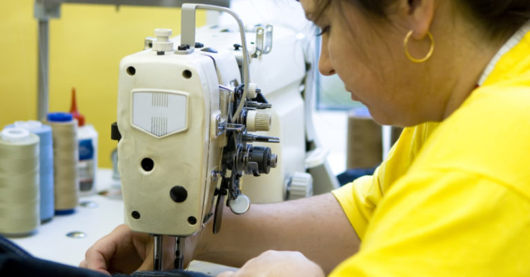 woman working on a sewing machine