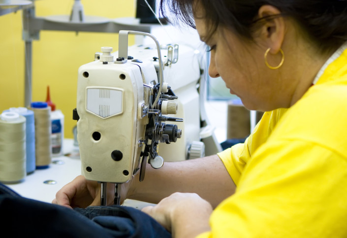 woman working on a sewing machine