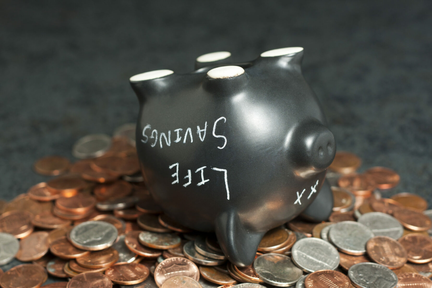a piggy bank poured out that has "life savings" written on it