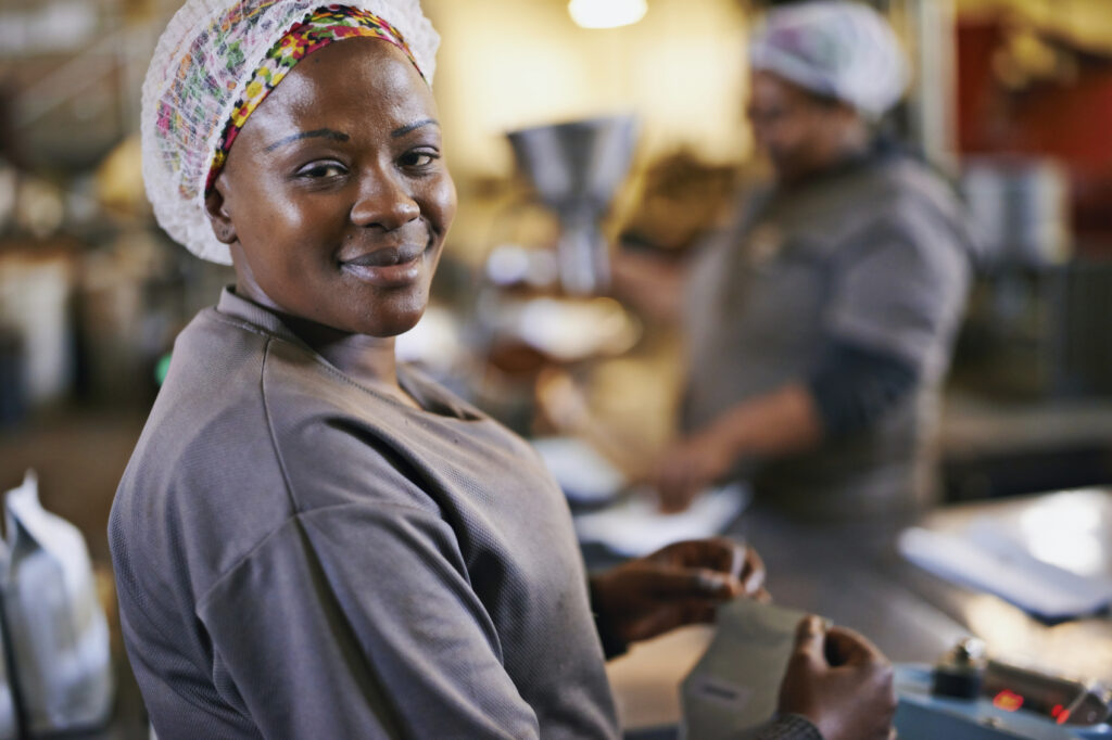 Portrait of a worker in a coffee packaging and distribution warehouse
