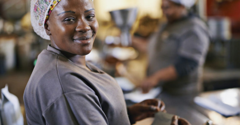 Portrait of a worker in a coffee packaging and distribution warehouse