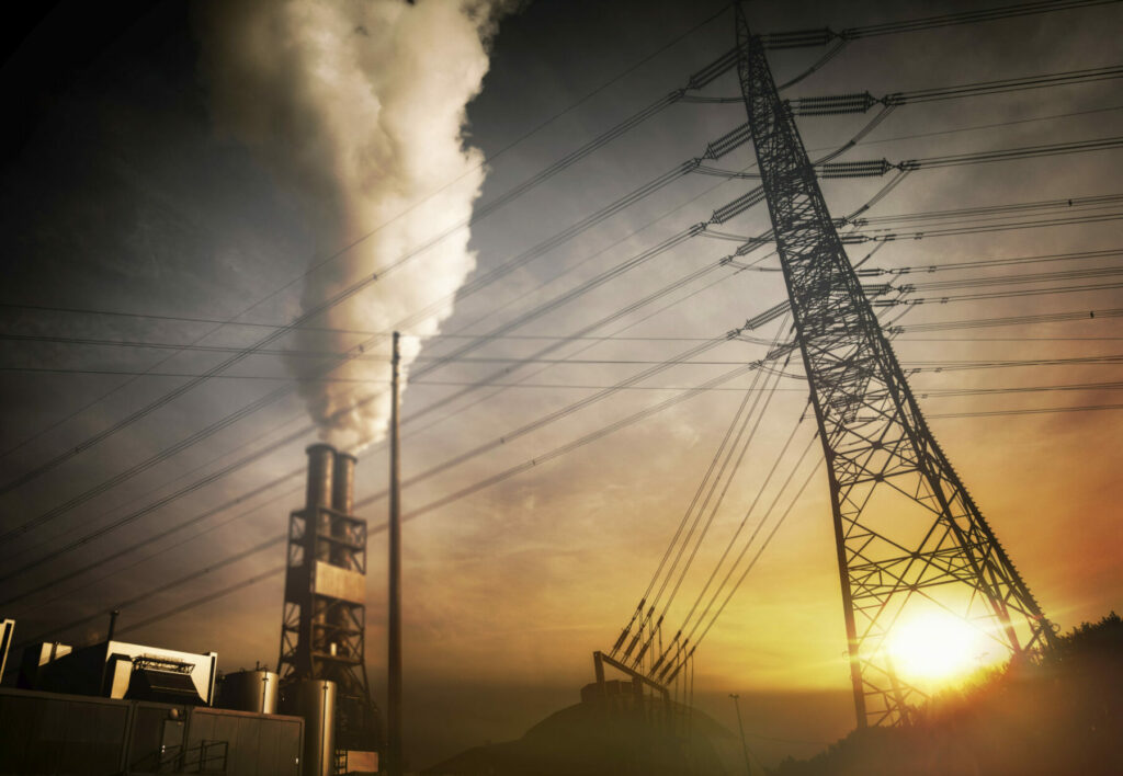 photo of power lines and smoke coming from a chimney.