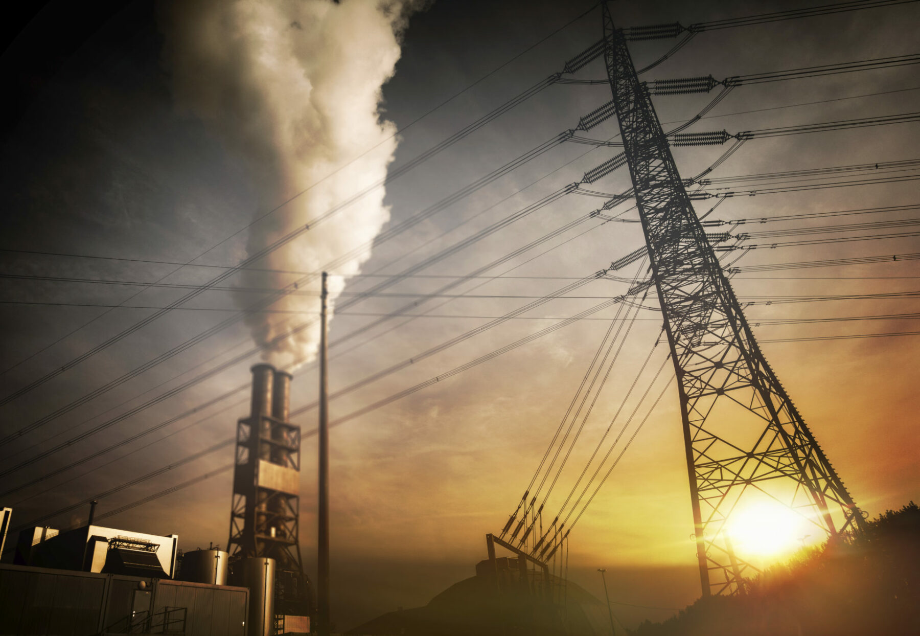 photo of power lines and smoke coming from a chimney.