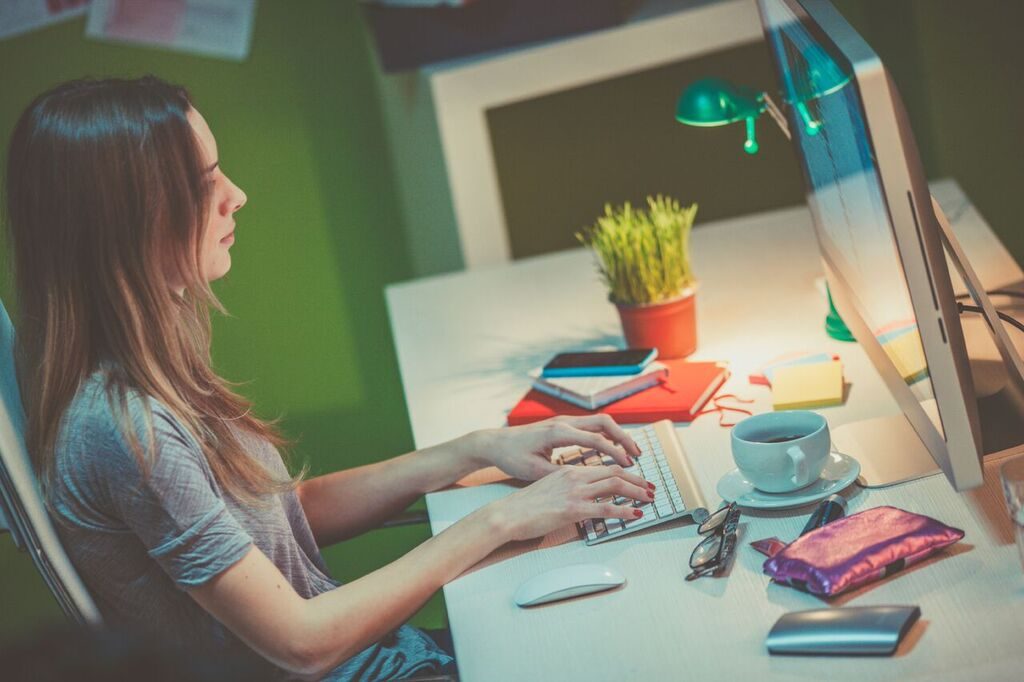 girl typing on computer