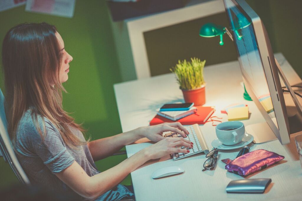 girl typing on computer
