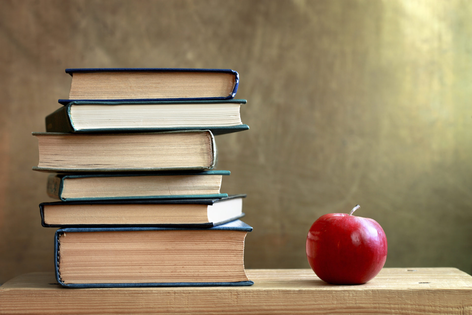 Stack of Books and Apple