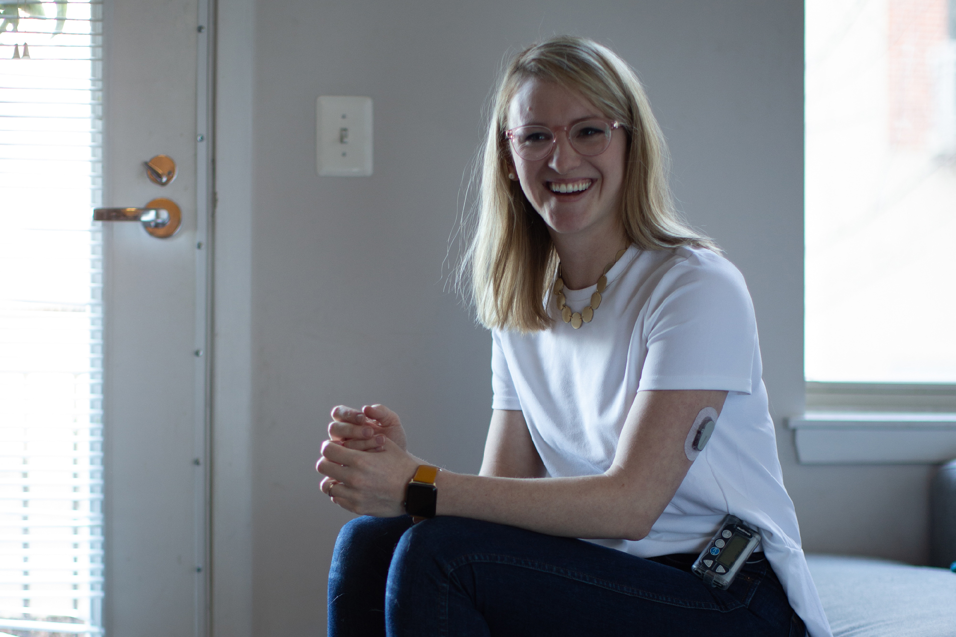 woman smiling outside in workout clothes