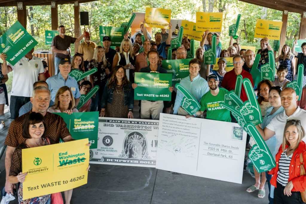 AFP-Kansas activists gather to raise awareness about the bait-and-switch infrastructure plan.