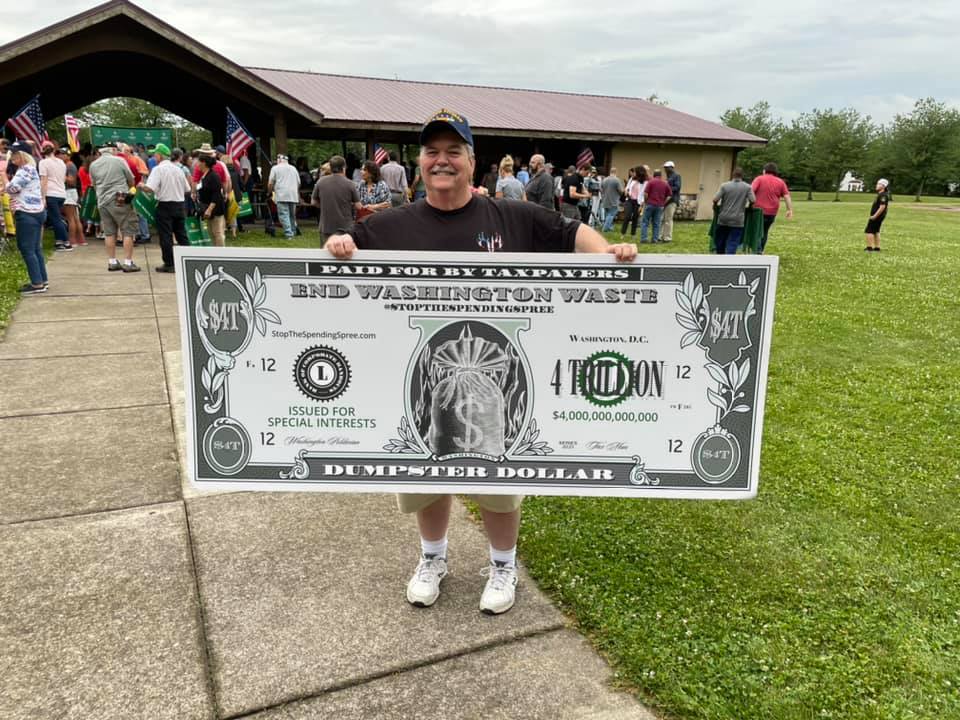 An Americans for Prosperity activist protests Washington's price tag (in the trillions!) for its reconciliation bill.