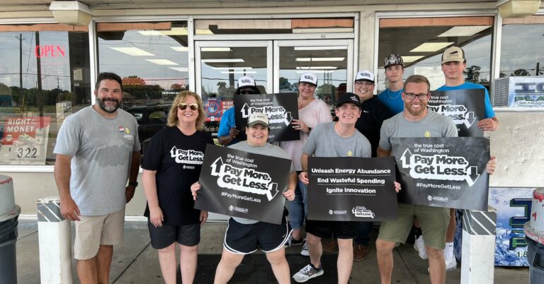 AFP-Mississippi staff pose for a photo outside a local Chevron station, where they helped provide discounted gas as relief from the high cost of gas in 2022.