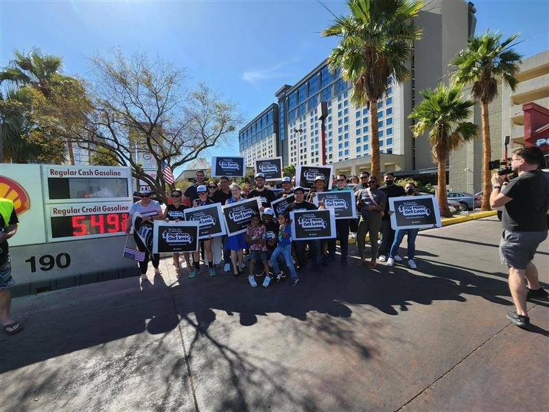 AFP-Nevada activists pose for a photo next to a sign listing the cost of gas at Jay's Market in Las Vegas. The event was part of AFP's True Cost of Washington Tour, which is stopping at gas stations to lower the cost of gas for customers and educate them about how Washington's reckless government spending is driving up gas prices. 