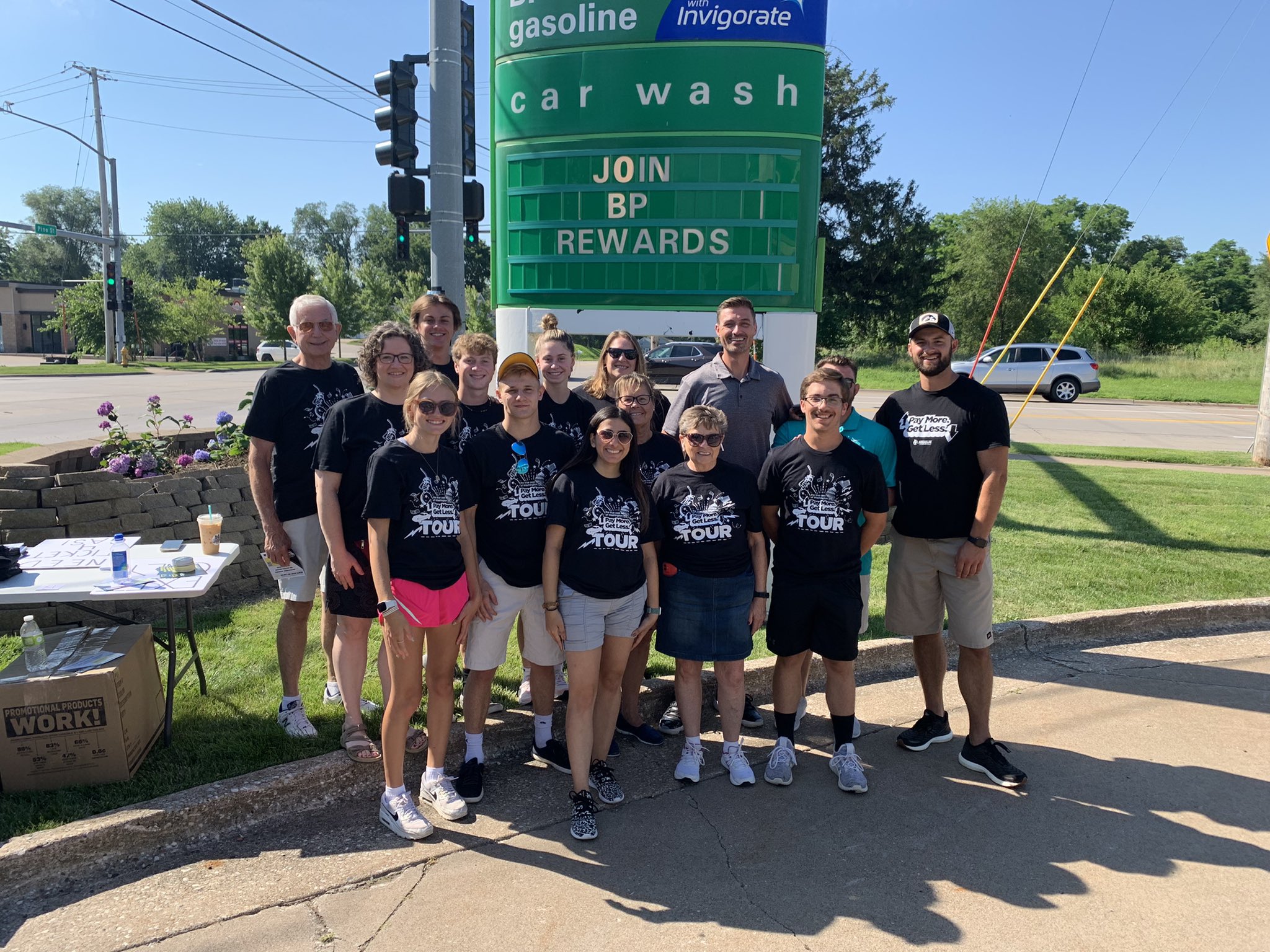 AFP-Iowa staff and volunteers before their True Cost of Washington event, where they provided customers with relief from the high cost of gas this year.