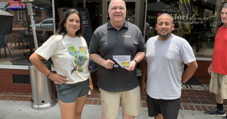 AFP staffer with customers at one of the True Cost of Washington Tour's many stops, where staffers heard from everyday Americans about how inflation was affection their families.