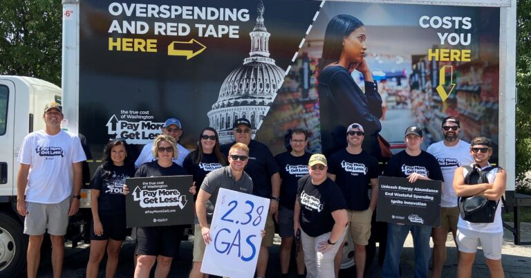 Greg Dowell with True Cost road crew and volunteers at a True Cost of Washington event to lower gas prices and discuss what is causing inflation