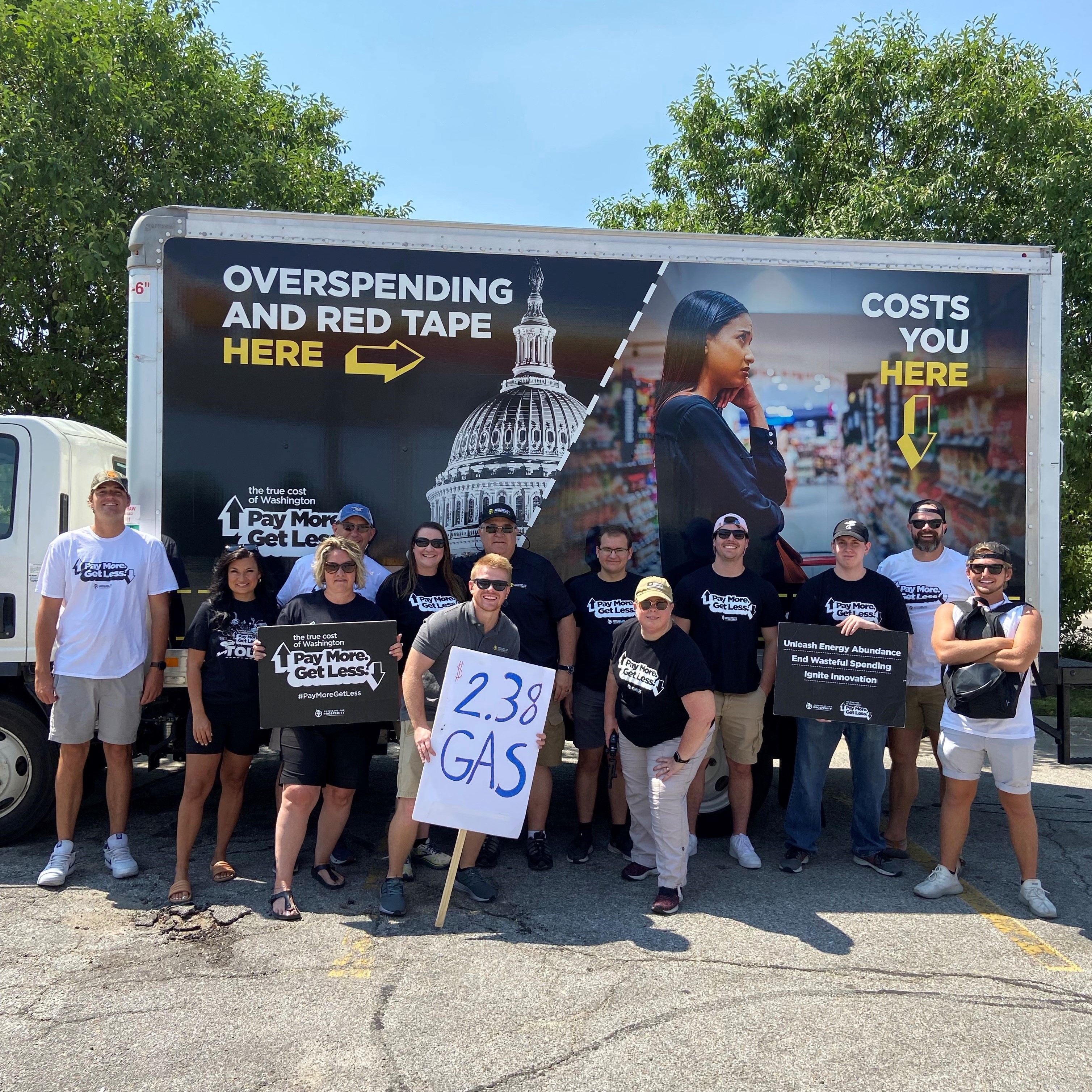 Greg Dowell with True Cost road crew and volunteers at a True Cost of Washington event to lower gas prices and discuss what is causing inflation