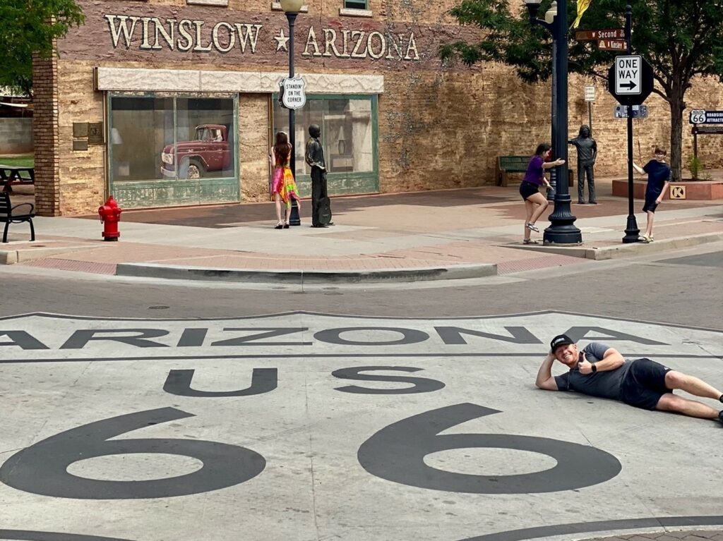 Spencer Evans enjoying a break on a corner in Winslow, Arizona, one of the many towns he and the True Cost of Washington road crew drove through to reach Americans with solutions for historic inflation. 