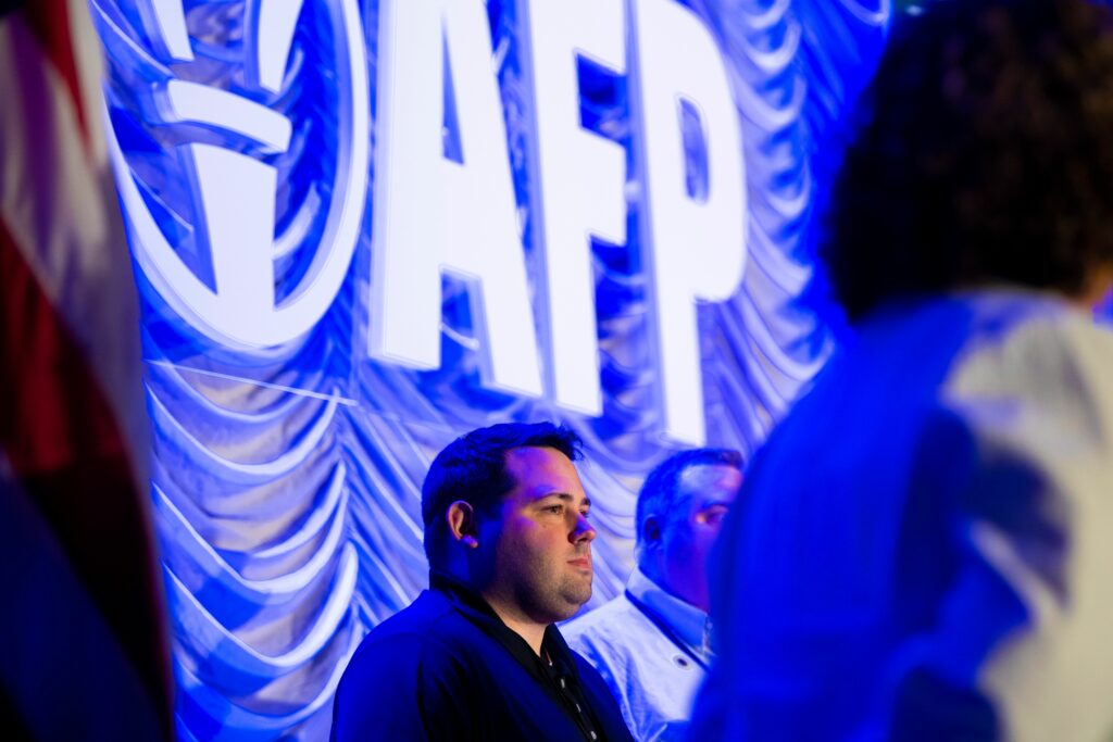 Cobi Bruner, grassroots engagement director for Americans for Prosperity-North Carolina, on stage at AFP's 2023 all-staff conference as a nominee of the George Gibbs 2023 Grassroots Engagement Director of the Year award.