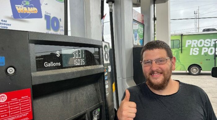 A satisfied customer at Prosperity Is Possible's Roll Back the Clock on Gas Prices event in Marion, Ohio