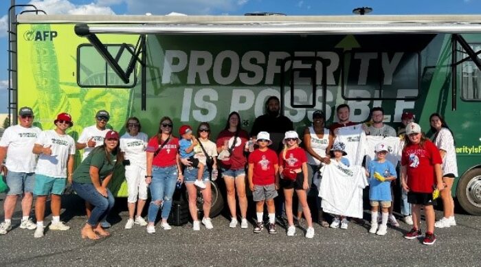 Prosperity Is Possible throws a curveball, tailgates with fans outside Philadelphia Phillies game.