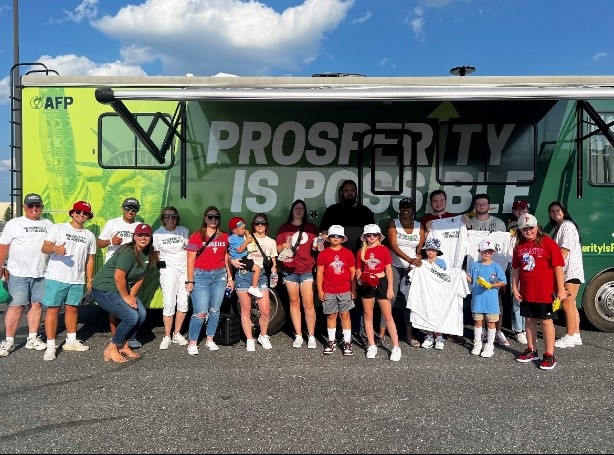 Prosperity Is Possible throws a curveball, tailgates with fans outside Philadelphia Phillies game.