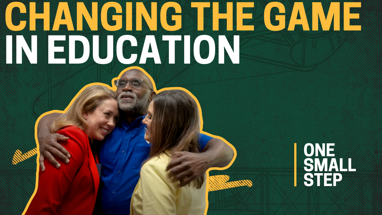 Image of Joe Enge hugging AFP employees with the text 'Changing the Game in Education.'